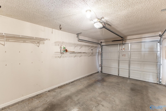 garage with baseboards and a garage door opener