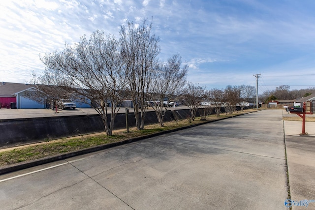 view of street featuring curbs