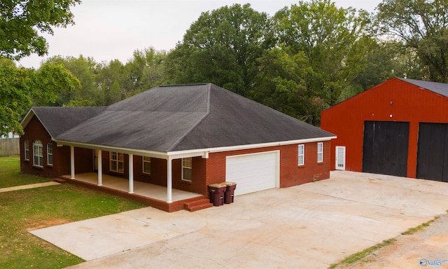 view of front of property featuring a garage and a front lawn