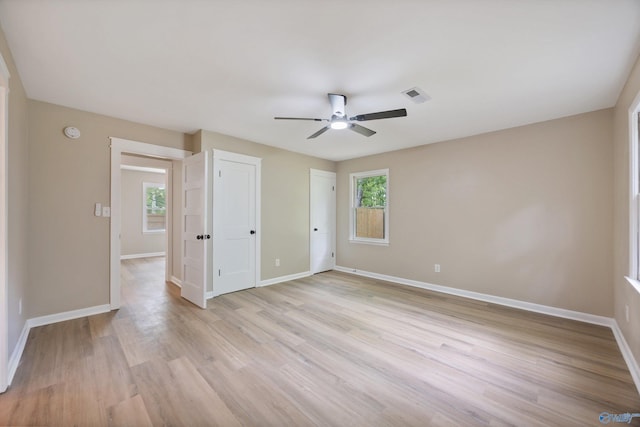 12034 Runningmeade Trl SE, Huntsville, AL 35803 - unfurnished bedroom with baseboards, light wood finished floors, and ceiling fan