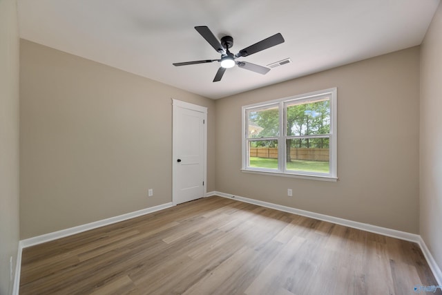 12034 Runningmeade Trl SE, Huntsville, AL 35803 - spare room with baseboards, light wood-style flooring, and a ceiling fan