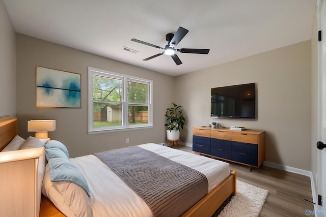 12034 Runningmeade Trl SE, Huntsville, AL 35803 - bedroom featuring light wood-type flooring, baseboards, and a ceiling fan