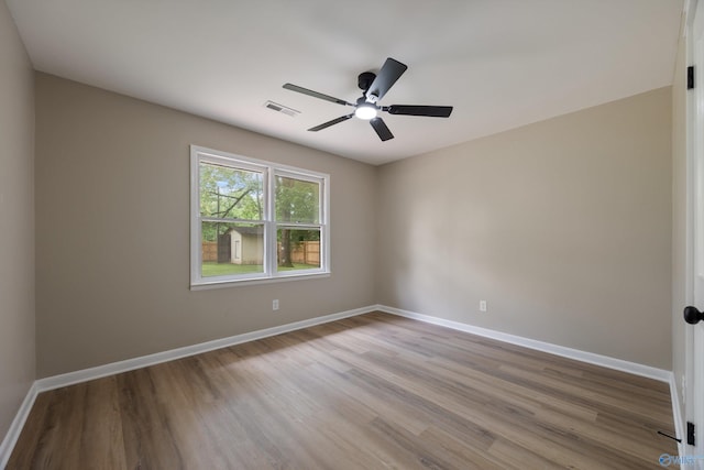 12034 Runningmeade Trl SE, Huntsville, AL 35803 - empty room with wood finished floors, baseboards, and a ceiling fan