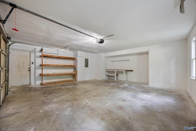 12034 Runningmeade Trl SE, Huntsville, AL 35803 - garage with electric panel, a garage door opener, and baseboards