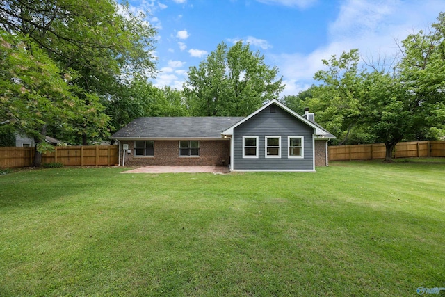 12034 Runningmeade Trl SE, Huntsville, AL 35803 - back of property featuring a patio area, brick siding, and view of scattered trees