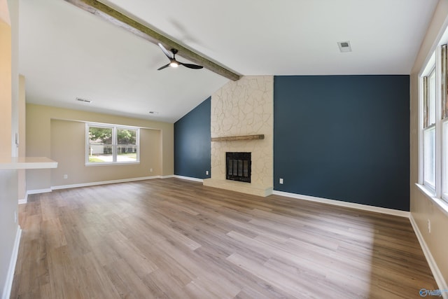 12034 Runningmeade Trl SE, Huntsville, AL 35803 - unfurnished living room with ceiling fan, wood finished floors, a fireplace, and baseboards