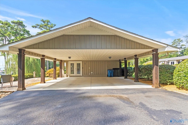 view of parking / parking lot with a carport and french doors