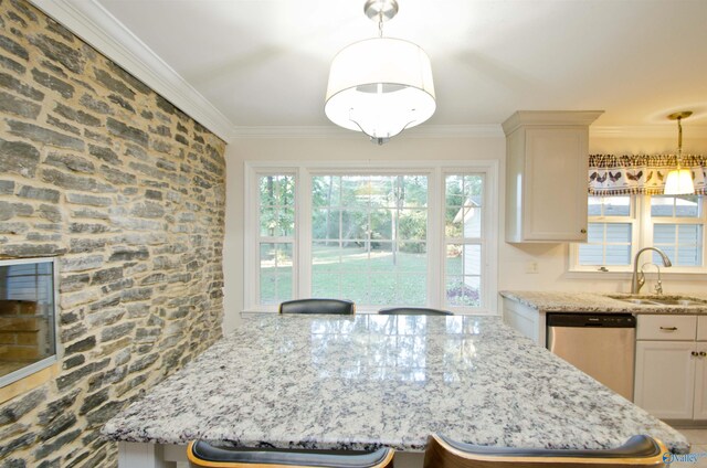 kitchen with sink, crown molding, dishwasher, and hanging light fixtures