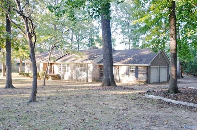 single story home with a garage