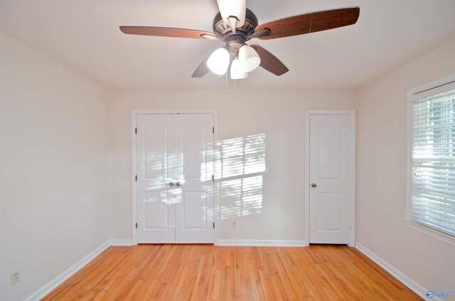 unfurnished room with light hardwood / wood-style floors and ceiling fan