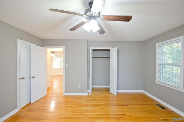 unfurnished bedroom featuring light hardwood / wood-style floors and ceiling fan