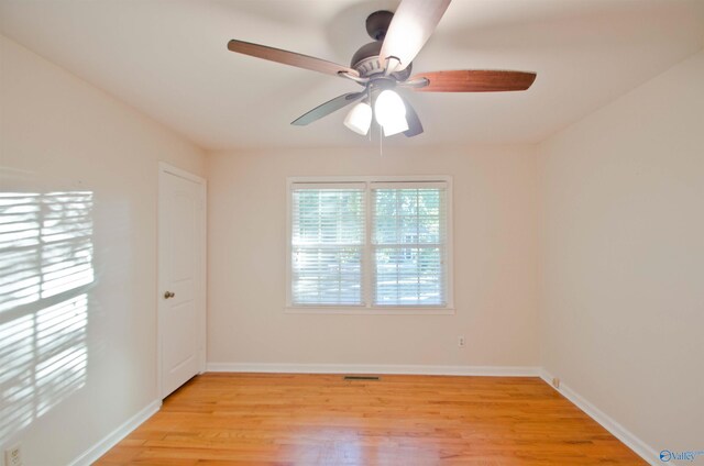 spare room featuring light wood-type flooring and ceiling fan