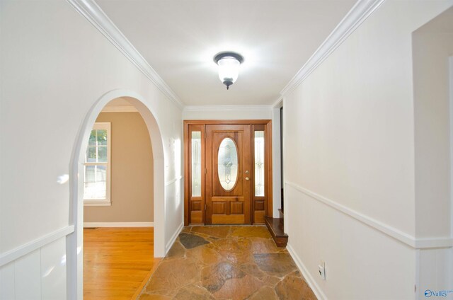 foyer featuring hardwood / wood-style flooring and ornamental molding