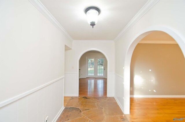 hall featuring french doors, crown molding, and hardwood / wood-style floors