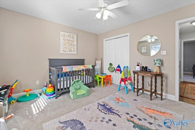 bedroom with carpet, baseboards, and a closet