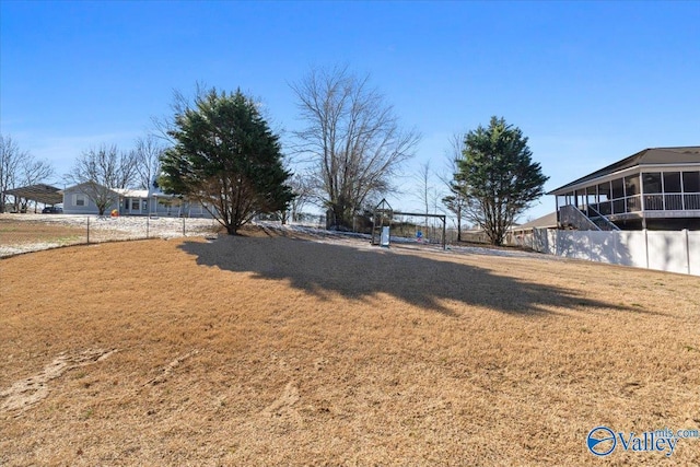 view of yard with fence and a pergola