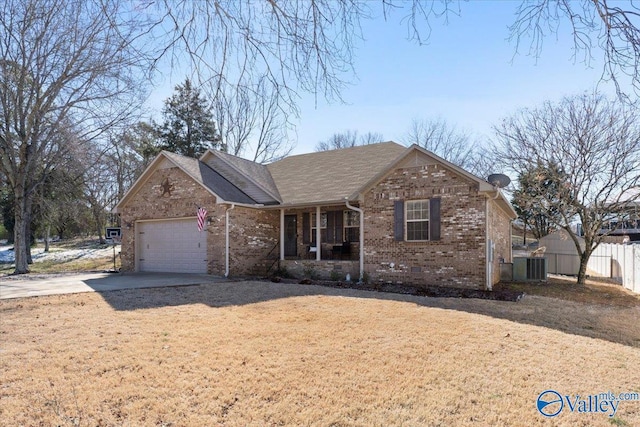 ranch-style house with driveway, crawl space, an attached garage, fence, and brick siding