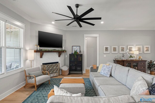 6320 Loring Loop NW, Huntsville, AL 35806 - living room with wood finished floors, healthy amount of natural light, ceiling fan, a brick fireplace, and recessed lighting
