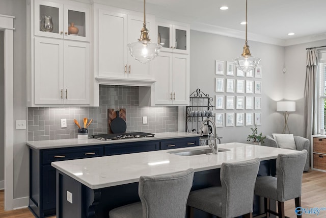 6320 Loring Loop NW, Huntsville, AL 35806 - kitchen with stainless steel gas stovetop, light wood-style flooring, a breakfast bar area, decorative backsplash, and recessed lighting
