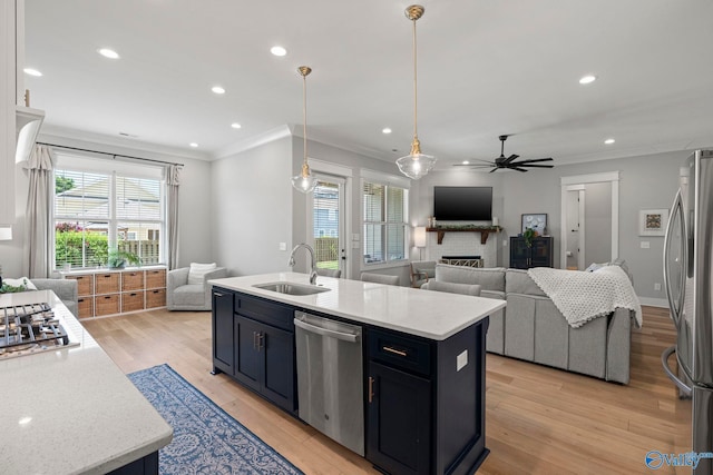 6320 Loring Loop NW, Huntsville, AL 35806 - kitchen featuring appliances with stainless steel finishes, open floor plan, ceiling fan, a fireplace, and crown molding