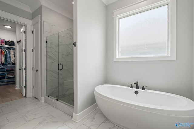 6320 Loring Loop NW, Huntsville, AL 35806 - full bath featuring marble look tiles, a freestanding tub, a spacious closet, and a marble finish shower