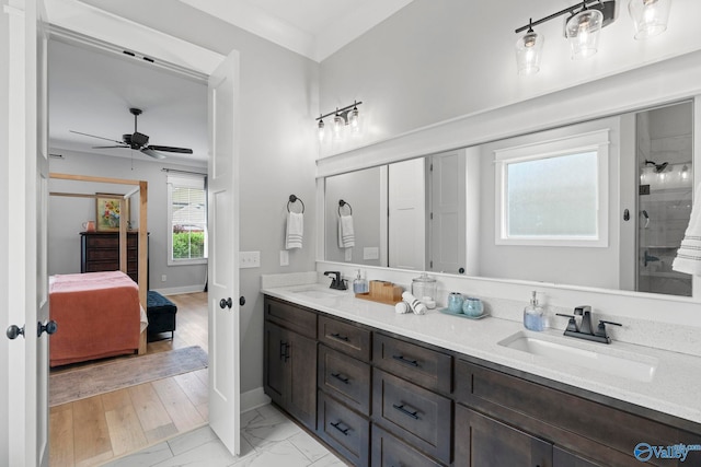 6320 Loring Loop NW, Huntsville, AL 35806 - bathroom featuring double vanity, a ceiling fan, tiled shower, ensuite bathroom, and marble look tiles