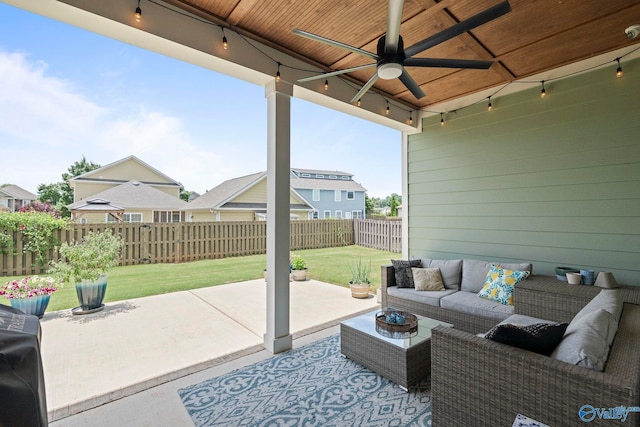 6320 Loring Loop NW, Huntsville, AL 35806 - fenced backyard featuring a ceiling fan, an outdoor hangout area, and a patio