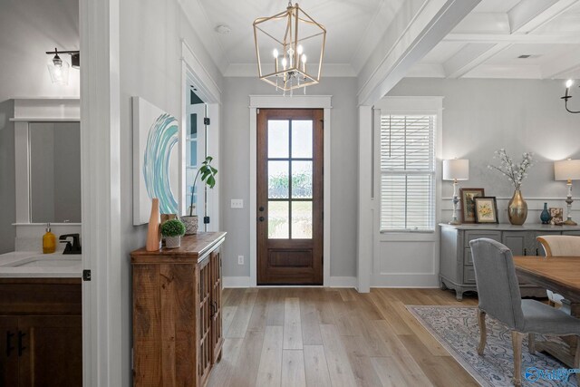 6320 Loring Loop NW, Huntsville, AL 35806 - entryway featuring light wood-style flooring, a chandelier, beamed ceiling, crown molding, and coffered ceiling