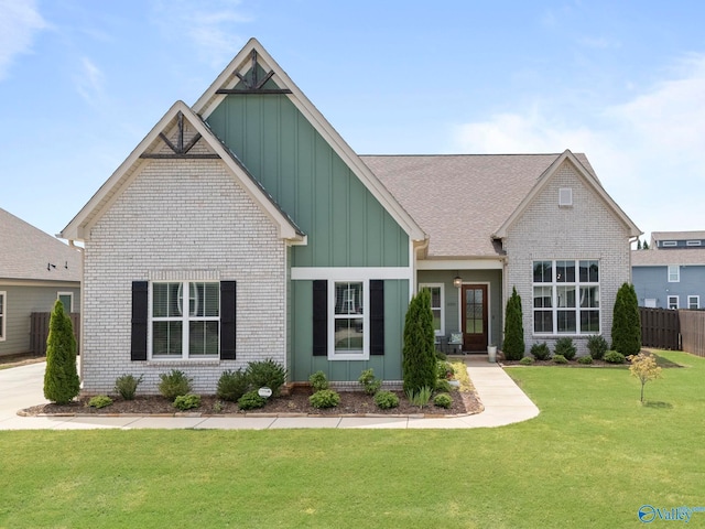 6320 Loring Loop NW, Huntsville, AL 35806 - view of front facade featuring board and batten siding, brick siding, and a shingled roof