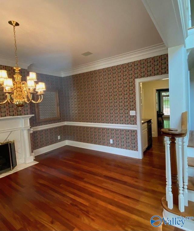 unfurnished living room featuring crown molding, dark hardwood / wood-style floors, and a premium fireplace