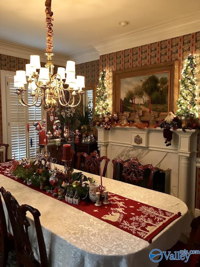 dining area featuring crown molding and an inviting chandelier