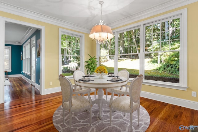 sunroom featuring a notable chandelier