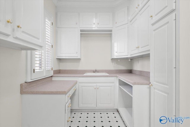 kitchen with sink and white cabinets