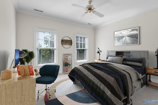 carpeted bedroom with crown molding and ceiling fan