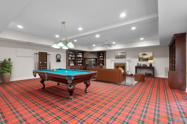 rec room featuring a raised ceiling, carpet floors, ceiling fan, and billiards