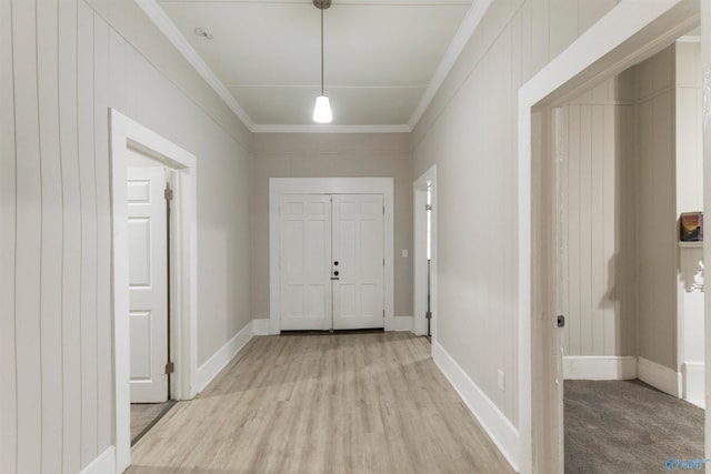 interior space with crown molding and light wood-type flooring