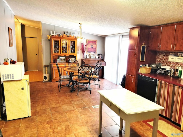 kitchen featuring decorative light fixtures, vaulted ceiling, a textured ceiling, and black dishwasher