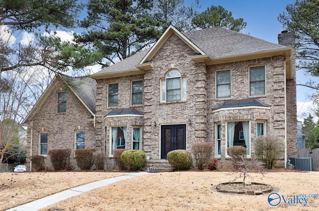 view of front of property featuring central AC unit and french doors