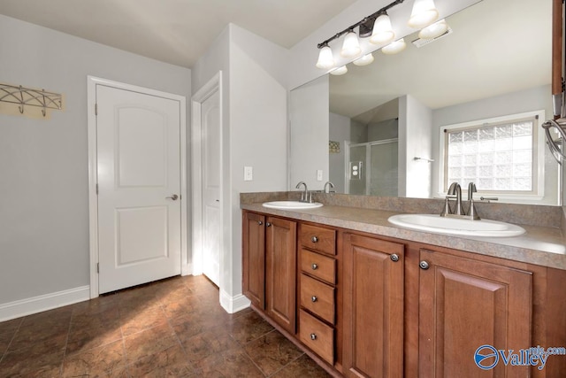 bathroom featuring vanity and a shower with shower door