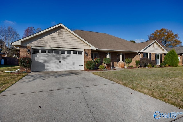 ranch-style home featuring a garage and a front lawn