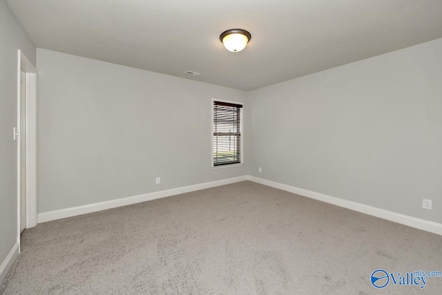 unfurnished room featuring carpet floors