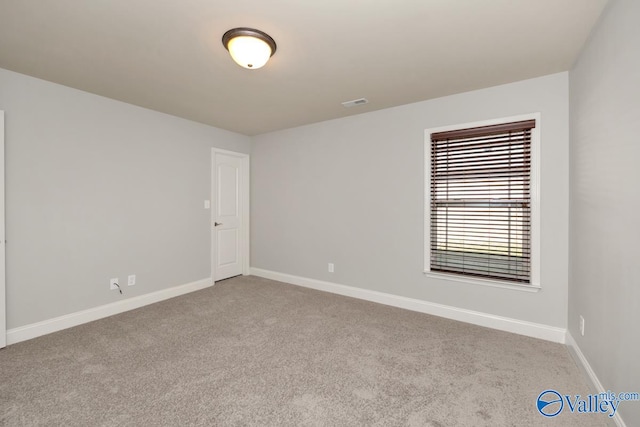 view of carpeted spare room