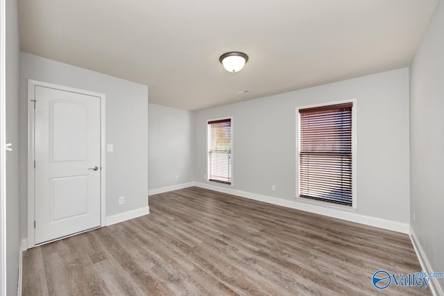 spare room featuring light hardwood / wood-style flooring