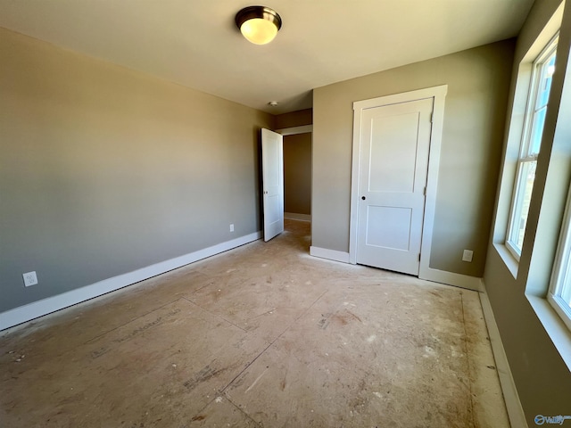 unfurnished bedroom with baseboards