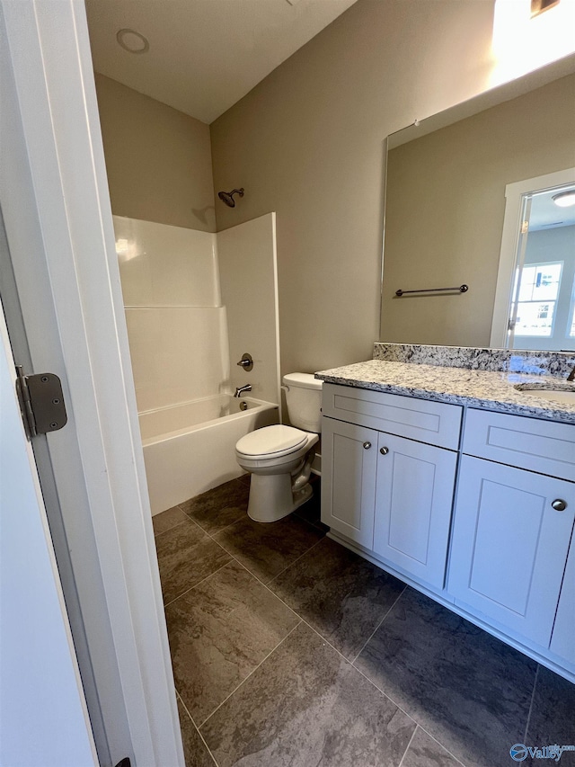 bathroom featuring toilet,  shower combination, and vanity