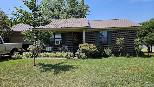 view of front of property with central AC, cooling unit, and a front yard