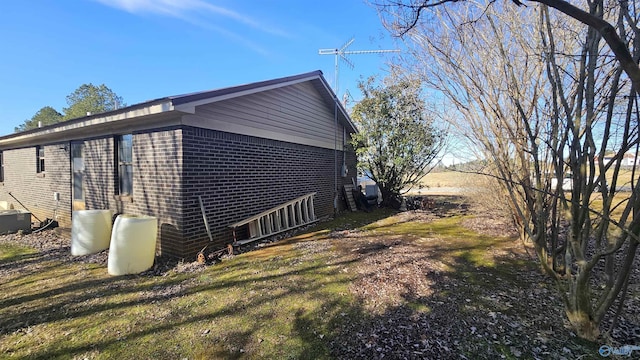 view of home's exterior with a lawn