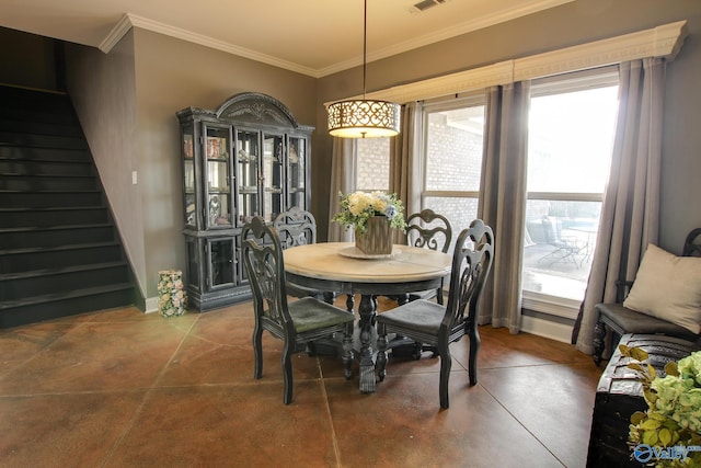 dining area featuring ornamental molding