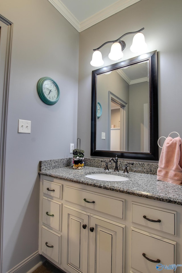 bathroom featuring vanity and crown molding