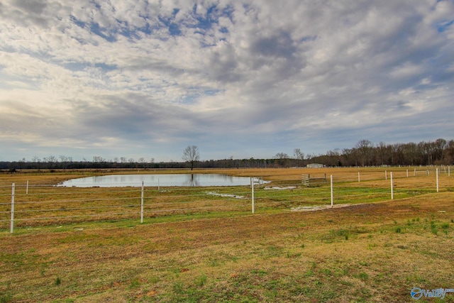 view of yard featuring a water view and a rural view